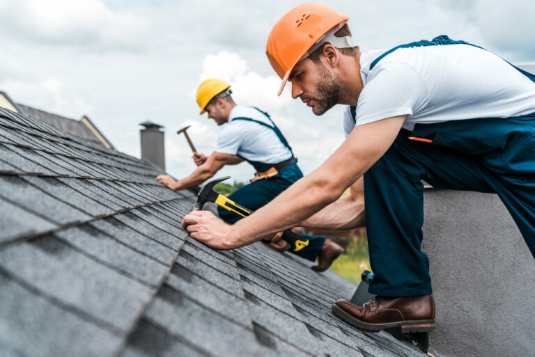 men working on a roof