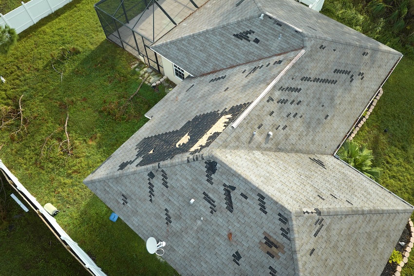 How To Choose The Right Roofing Shingles For Your Greenville, SC Home Professional certified roofing contractor installing asphalt shingles on residential home in Greenville SC showing expert installation technique